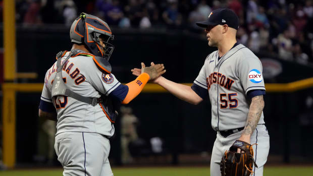 Sep 29, 2023; Phoenix, Arizona, USA; Houston Astros catcher Martin Maldonado (15) and pitcher Ryan Pressly (55) celebrates after defeating the Arizona Diamondbacks at Chase Field. Mandatory Credit: Rick Scuteri-USA TODAY Sports  